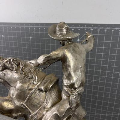 "The Bronco Buster" by Frederic Remington in Silver
