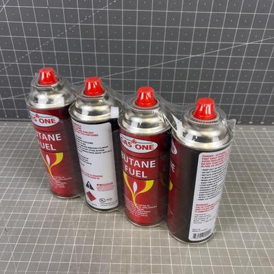 (4) NEW BUTANE CANS