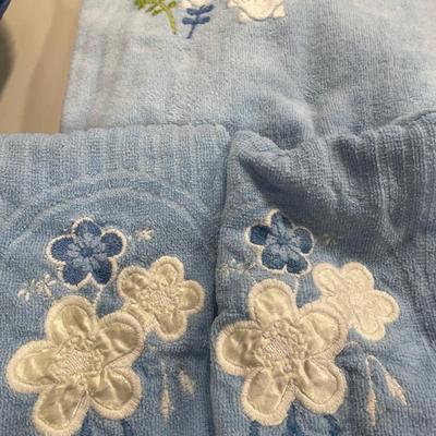 Blue fabric shower curtain and towels