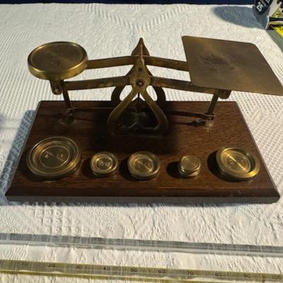 Sale Photo Thumbnail #104: Scale and other measuring items:  Scale brass and wood with weights 4oz, 2oz, 1oz, 1/2oz, etc.  Warranted accurate made in England.  3 glass thermometers 1) Frey #7061 USA, 2) Fisher brand 541599 Korea, 3) Gerathem.  2 plastic compasses, Leitz 1790-6 prot