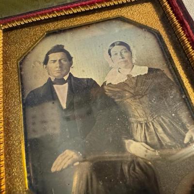 Sale Photo Thumbnail #395: Antique Album as is over 100 years old 11" x 8.5" x 2.5", 5 photo frames. 2 of the frames are 3.5" x 4", and 3 frames are 2.5" x 2 3/4" x 1/4".  An as is dictionary and religious on wood Mary and child.  8 items total.  Daguerreotypes. Ambrotype.  Tintype