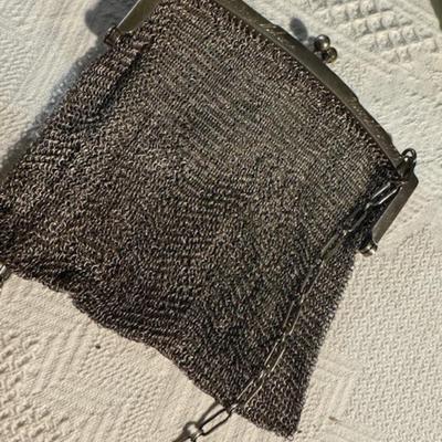 Sale Photo Thumbnail #1171: Sterling mesh antique purse as found 2 small holes were located after close inspection.  Other than that in excellent condition.  See pictures.  Has some writing on the top part of purse.