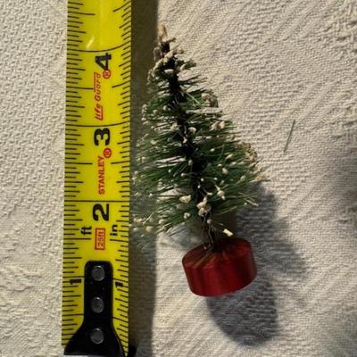 Sale Photo Thumbnail #1218: 2 Vintage bottle brush trees and wooden thread bobbin Santa as found see pics.