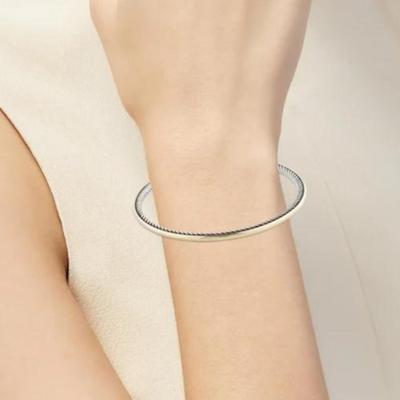 ESTATE DAVID YURMAN TWO TONED BANGLE STERLING AND 18K GOLD