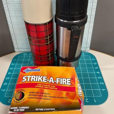 2 vintage thermoses and box of strike a fire