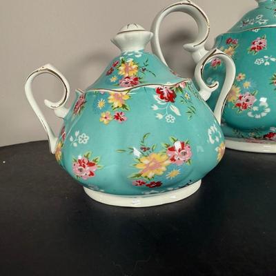 LOT 61K: Gracie China by Coastline Imports Teapots - one w/ Matching Sugar Bowl & Creamer, one w/ Matching Teacups & Saucers