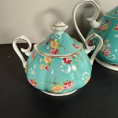LOT 61K: Gracie China by Coastline Imports Teapots - one w/ Matching Sugar Bowl & Creamer, one w/ Matching Teacups & Saucers
