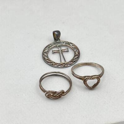 LOT 90J: Sterling Silver Jewelry - Two Size 6 Rings and "Believe" Cross Pendant