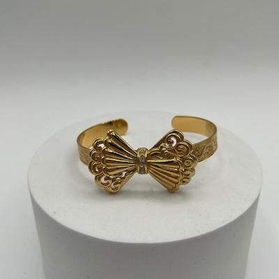 LOT 95J: Gold Tone Bracelets and Earrings