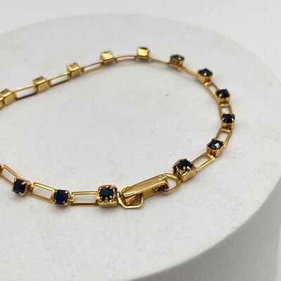 LOT 95J: Gold Tone Bracelets and Earrings