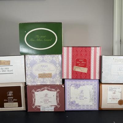 LOT 192D: Avon President’s Club Mrs. Albee Awards in Boxes 1990, 1994, 1996-2002