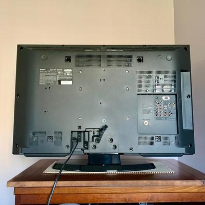 LOT 219 M: Sony Bravia LCD TV Model #KDL-32L5000, LG DVD Player Model #DN191H, & Lazy Susan Top TV Stand Cabinet