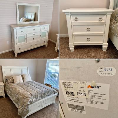 LOT 228 B: Ashley Furniture White Bedset: Sleigh Bed w/ 2 Drawers, 3 Drawer Bedside Table, 6 Drawer 2 Cabinet Dresser w/ Mirror