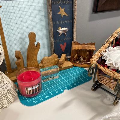 Nativity and angel decor with candle and sleigh