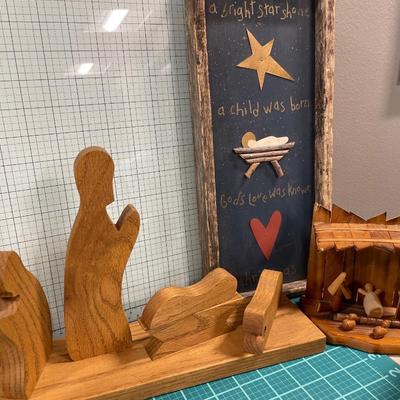 Nativity and angel decor with candle and sleigh