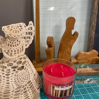 Nativity and angel decor with candle and sleigh