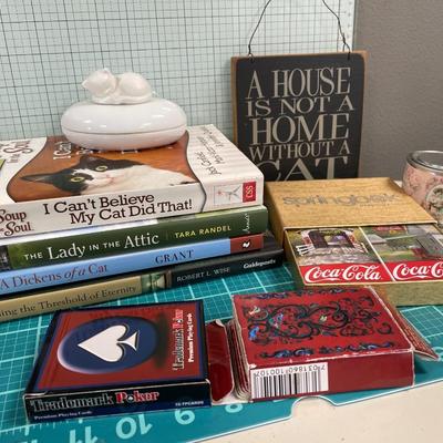 Cat decor, books, cards and “can”dle