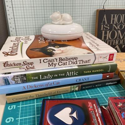 Cat decor, books, cards and “can”dle