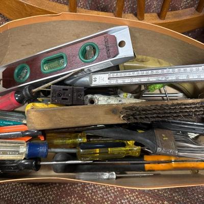 Goody box of screwdrivers, brushes, level, etc.