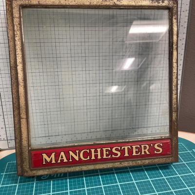 Vintage Manchester’s countertop buscuit display with mercurochrome bottle and milk glass ashtray