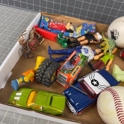 Tray of Toys: Pez, Die Cast Cars act