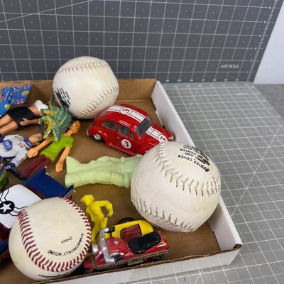 Tray of Toys: Pez, Die Cast Cars act