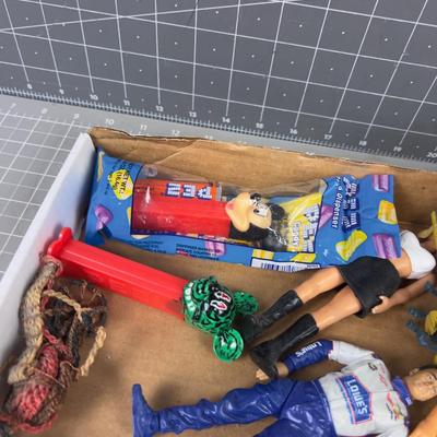 Tray of Toys: Pez, Die Cast Cars act