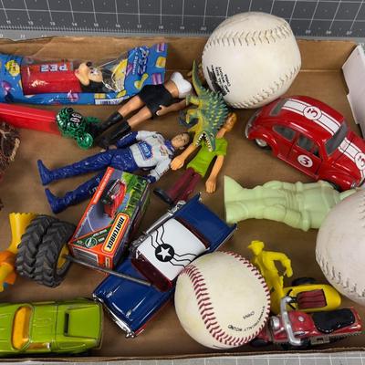Tray of Toys: Pez, Die Cast Cars act