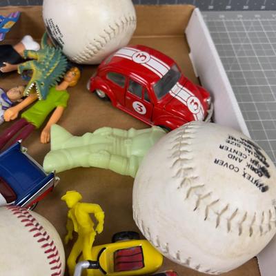 Tray of Toys: Pez, Die Cast Cars act