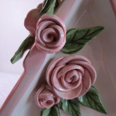 Mudpie ceramic birdhouse decorated with pink rosettes