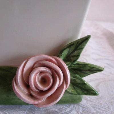 Mudpie ceramic birdhouse decorated with pink rosettes