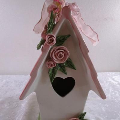 Mudpie ceramic birdhouse decorated with pink rosettes