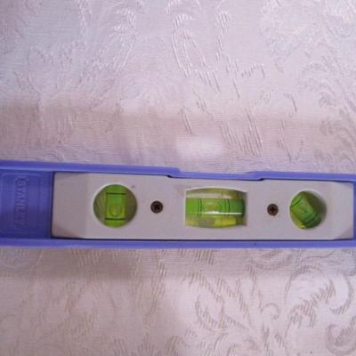 roll of 2" Duck tape, Stanley level 9" x 1-1/2"