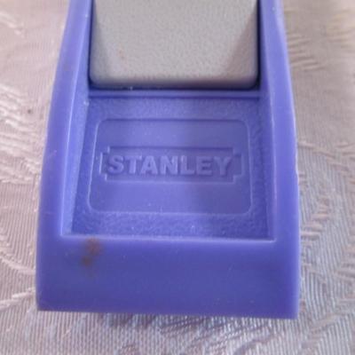 roll of 2" Duck tape, Stanley level 9" x 1-1/2"