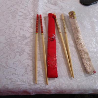 2 sets of chopsticks in cases