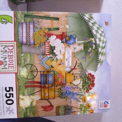 1 Picture Frame puzzle, 1 Siene Sunset puzzle, 1 Debbie Mumm puzzle