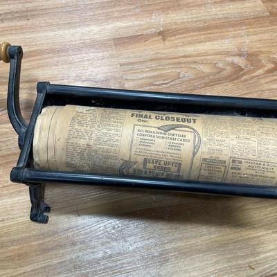 Vintage newspaper log roller