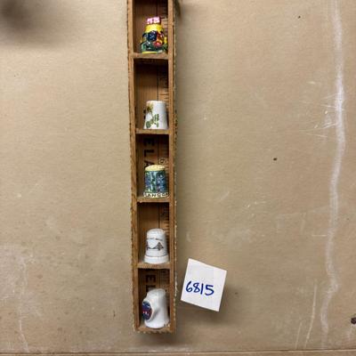 Thimble collection in ruler shelf