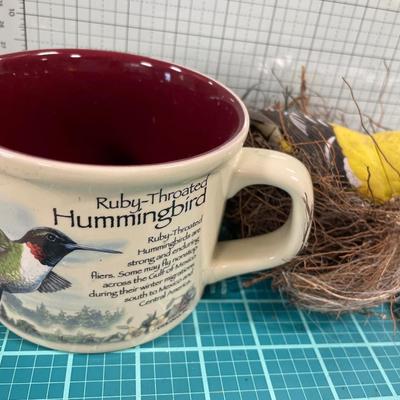 Game, bird in nest and mug