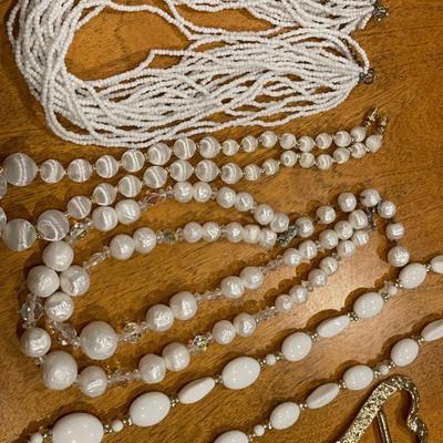 White beaded necklaces with heart scarf holder
