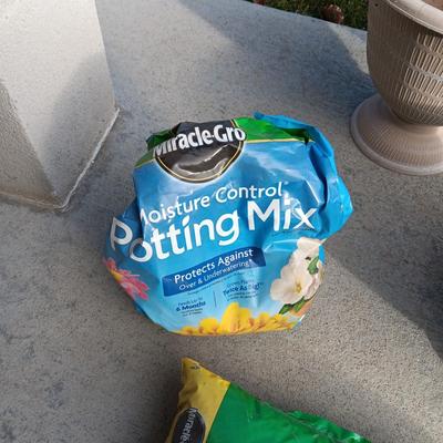 2 PLASTIC AND 1 CLAY FLOWER POTS PLUS BAG OF POTTING SOIL MIX