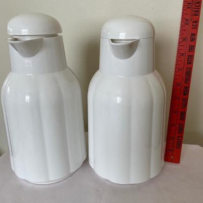 2 white plastic insulated coffee carafes