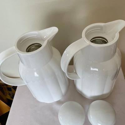 2 white plastic insulated coffee carafes