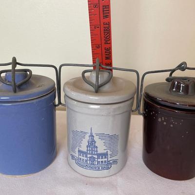 3 small stoneware crocks with lids