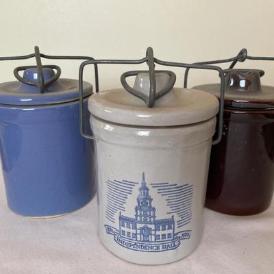 3 small stoneware crocks with lids