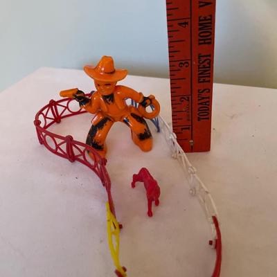 Toy cowboy, fence and horse