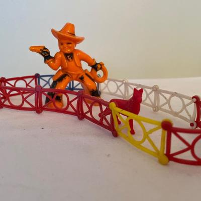 Toy cowboy, fence and horse