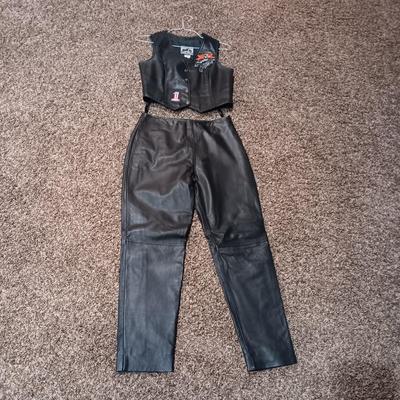LADIES LEATHER VEST W/STURGIS PEWTER PINS AND HARLEY DAVIDSON PATCH PLUS LEATHER PANTS