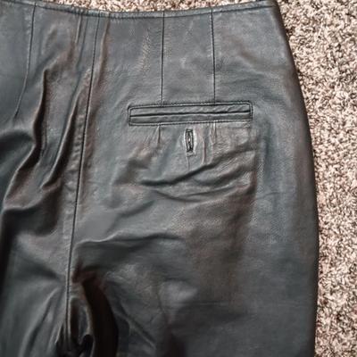 LADIES LEATHER VEST W/STURGIS PEWTER PINS AND HARLEY DAVIDSON PATCH PLUS LEATHER PANTS