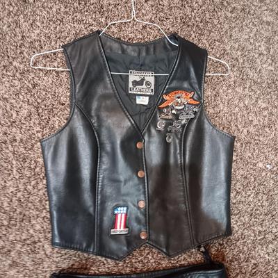 LADIES LEATHER VEST W/STURGIS PEWTER PINS AND HARLEY DAVIDSON PATCH PLUS LEATHER PANTS
